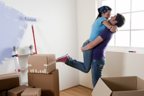 Professionals packing household items